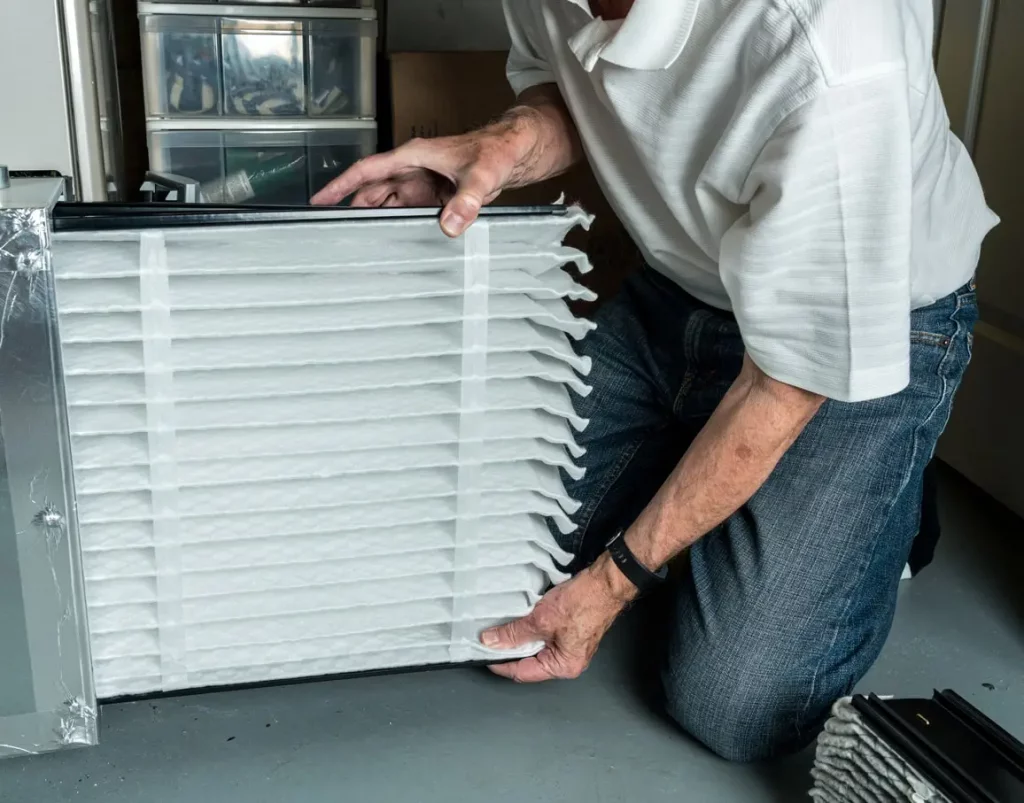 A technician is engaged in maintenance work on a HVAC Unit